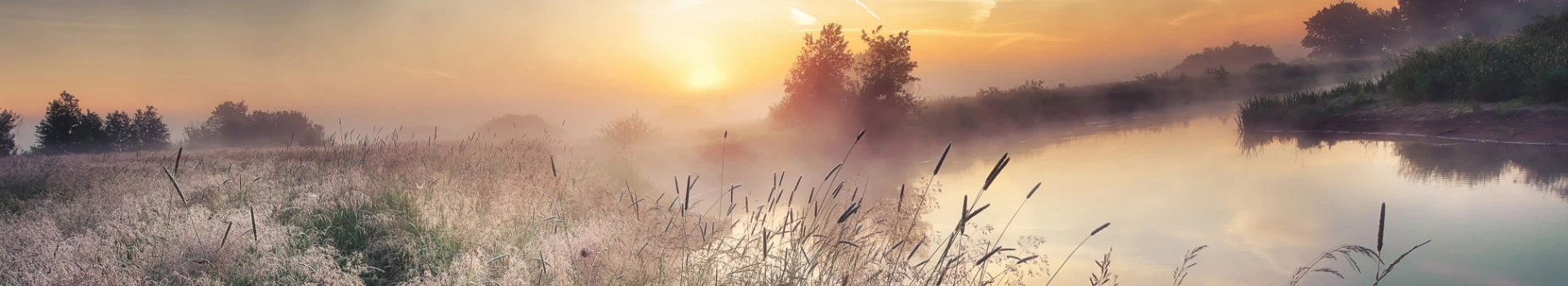 banner - zachodzące słońce nad jeziorem